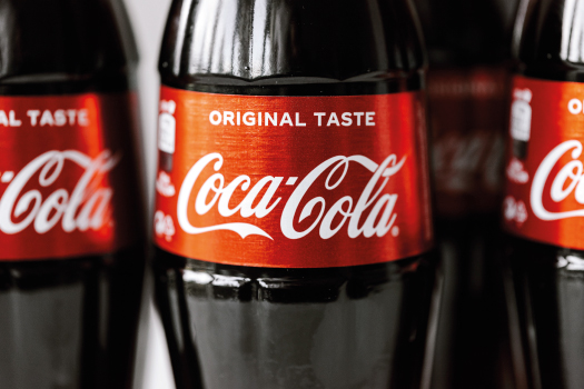 The coca cola logo on bottles